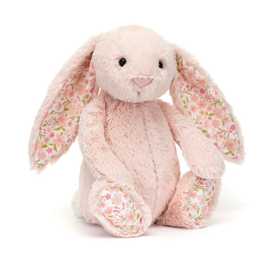 Floral-patterned plush bunny toy on a white background