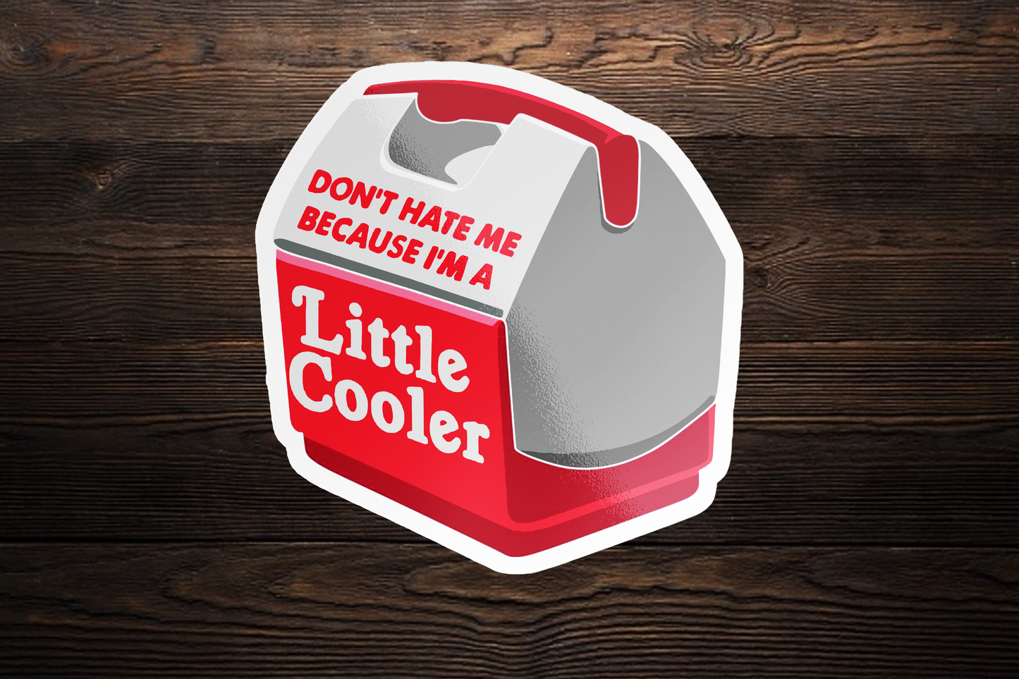 Sticker of a Little Cooler container with text "Don't Hate Me I'm A Little Cooler" on a wooden background