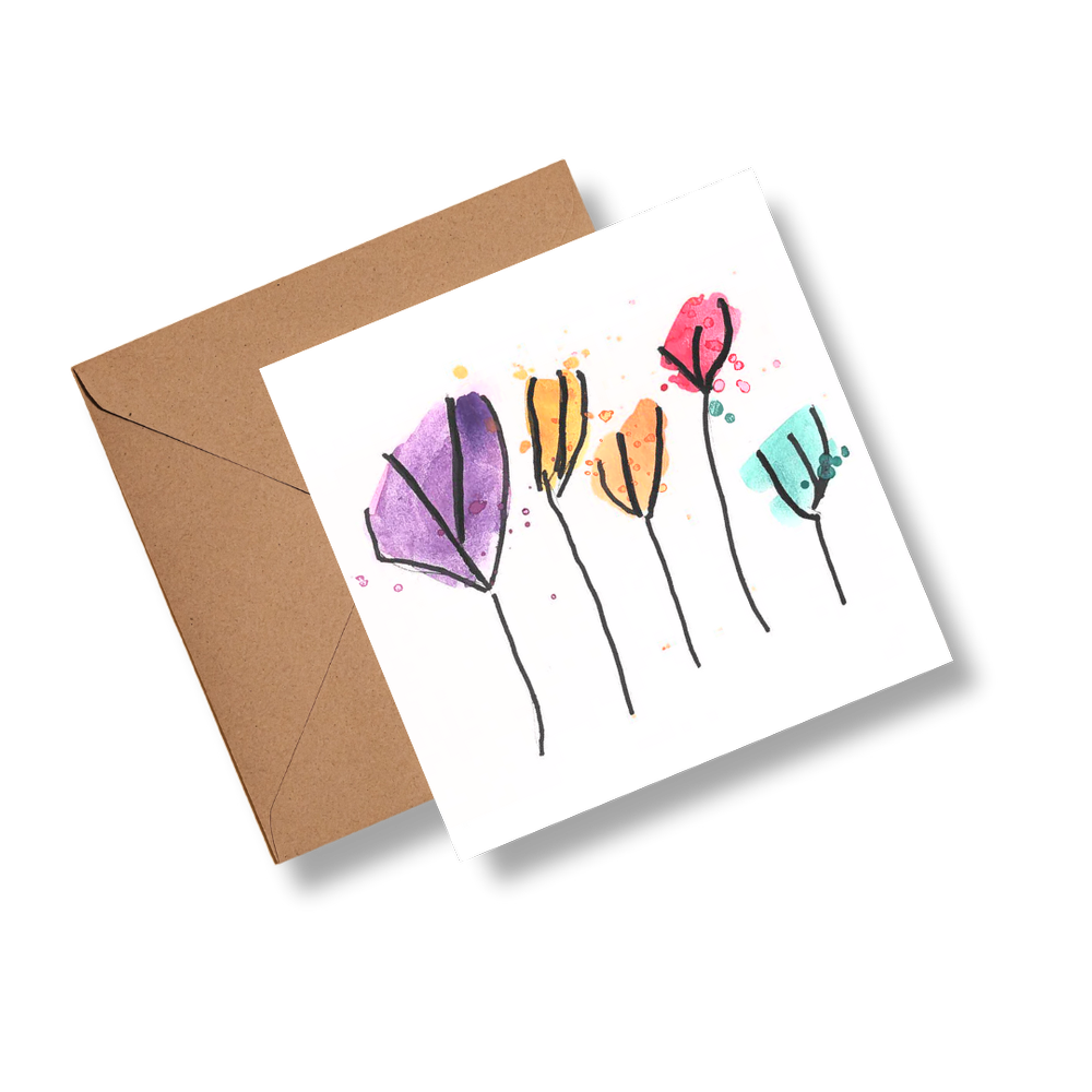 Greeting card with colorful floral design and brown envelope on white background