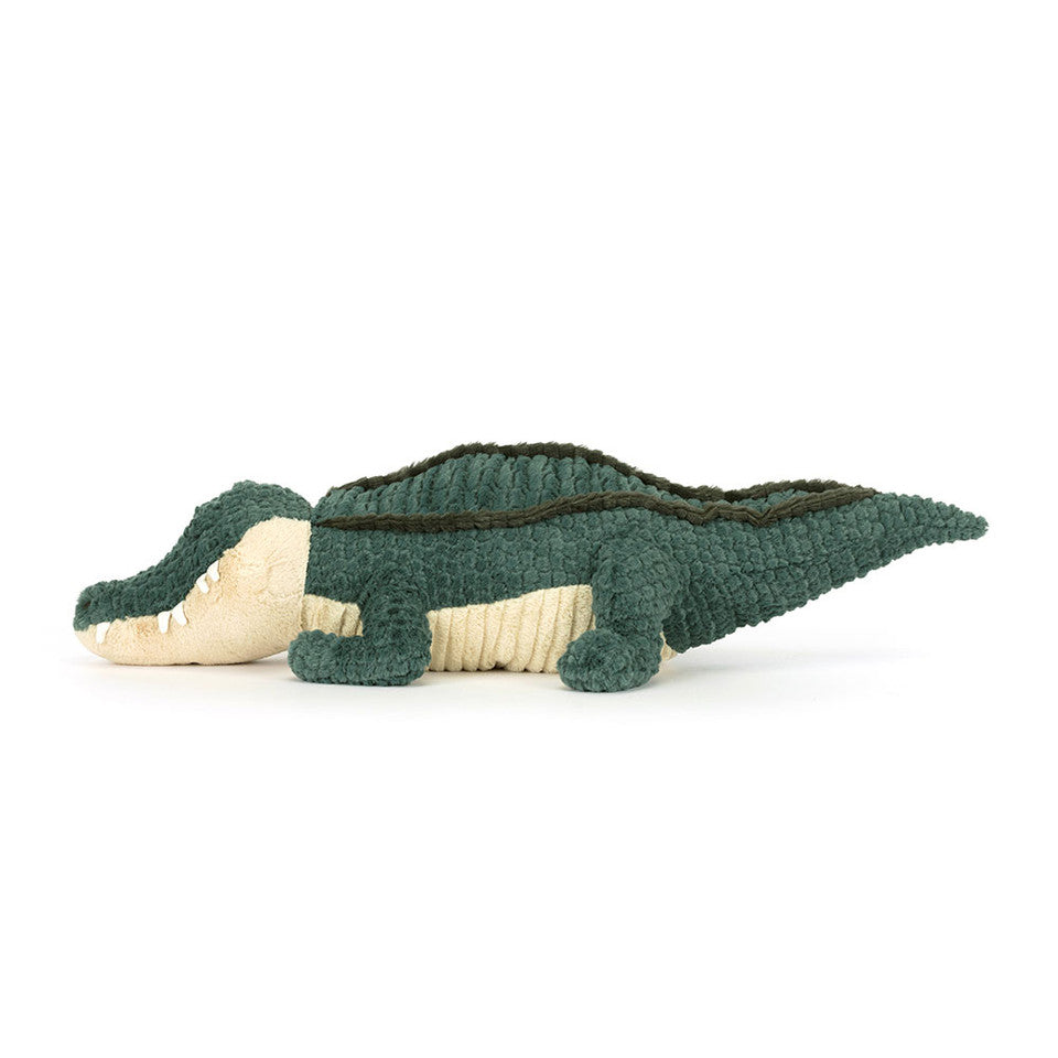 Toy alligator on a white background