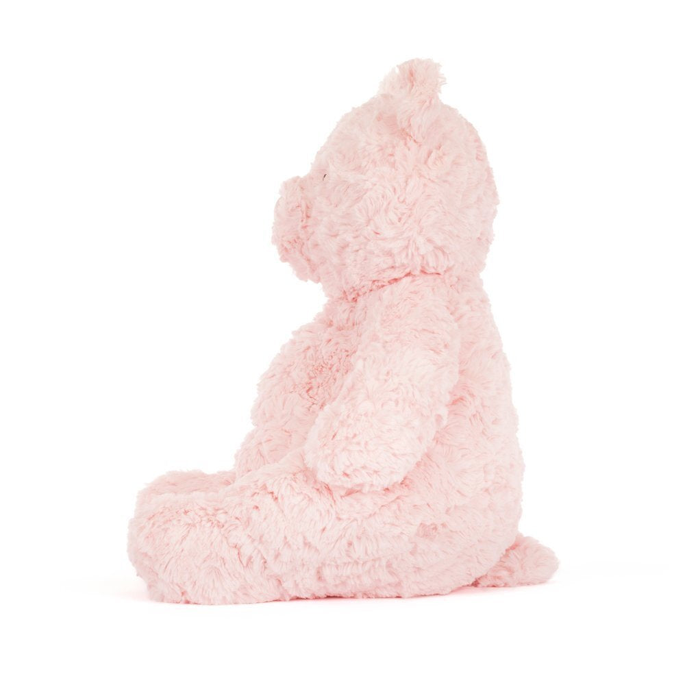 Pink plush teddy bear on a white background