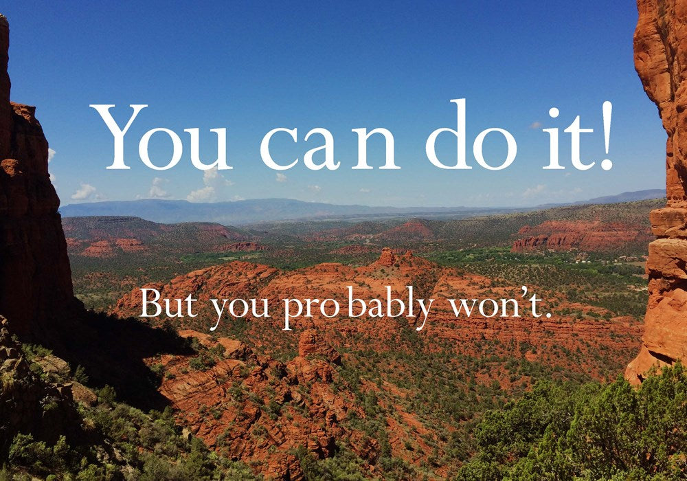 Scenic view of a desert landscape with red rock formations and a clear blue sky, overlaid with motivational text.