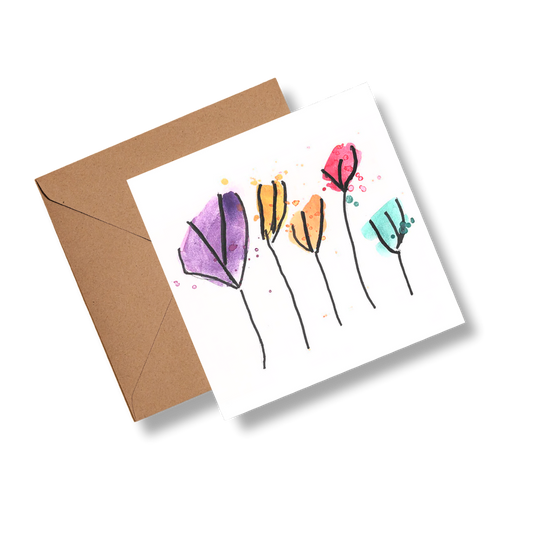 Greeting card with colorful floral design and brown envelope on white background