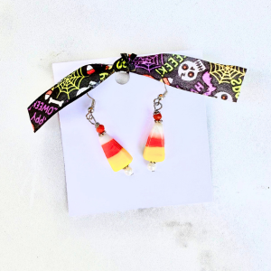 Cany corn earrings on a white background
