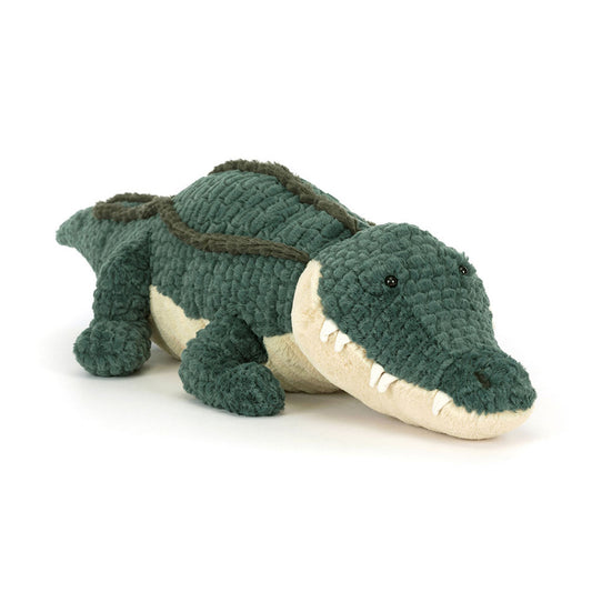 Plush toy alligator on a white background