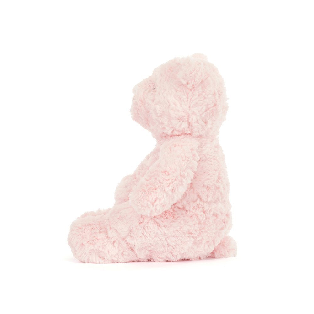 Pink plush teddy bear on a white background