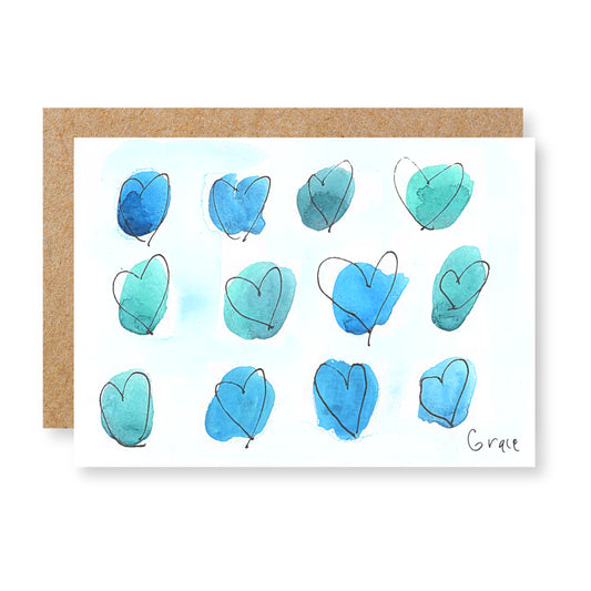 Greeting card with blue heart shapes on a white background