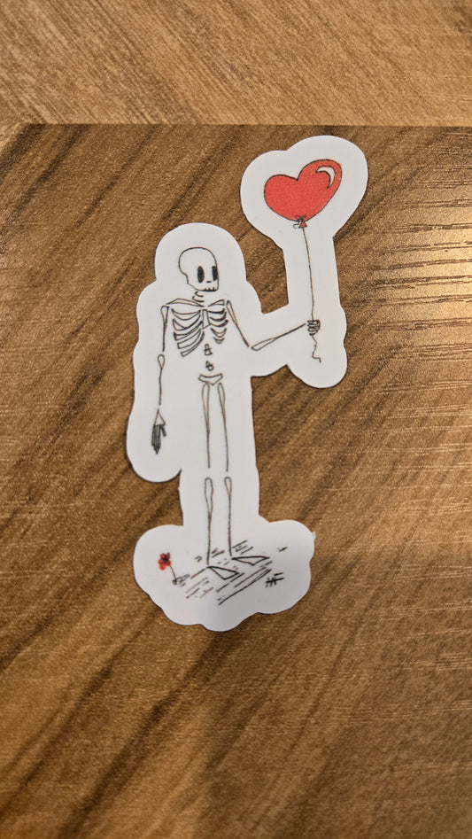 Sticker of a skeleton holding a heart balloon